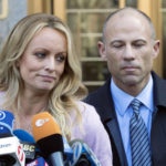 
              FILE- Adult film actress Stormy Daniels, accompanied by her attorney, Michael Avenatti, right, talks to the media as she leaves federal court, on April 16, 2018 in New York. Avenatti, the once high-profile California attorney who regularly taunted then-President Donald Trump during frequent television appearances, was introduced Thursday, Jan. 20, 2022, to prospective jurors who will decide whether he cheated porn star Stormy Daniels out of book-deal proceeds. (AP Photo/Mary Altaffer, File)
            