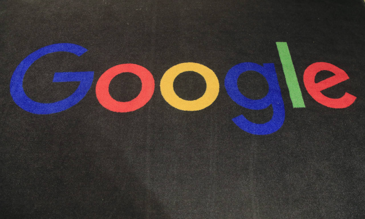 FILE - The logo of Google is displayed on a carpet at the entrance hall of Google France in Paris, ...