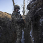 
              A Ukrainian soldier stands in the trench on the line of separation from pro-Russian rebels, in Mariupol, Donetsk region, Ukraine, Thursday, Jan. 20, 2022. President Joe Biden has warned Russia's Vladimir Putin that the U.S. could impose new sanctions against Russia if it takes further military action against Ukraine. U.S. Secretary of State Antony Blinken is warning of a unified, "swift, severe" response from the United States and its allies if Russia sends any military forces into Ukraine. (AP Photo/Andriy Dubchak)
            