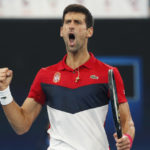 
              FILE - Novak Djokovic, of Serbia, reacts to winning the first set against Daniil Medvedev, of Russia, during their ATP Cup tennis match in Sydney, Jan. 11, 2020. (AP Photo/Steve Christo, File)
            