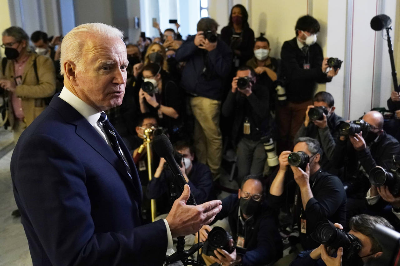 President Joe Biden speaks to the media after meeting privately with Senate Democrats, Thursday, Ja...