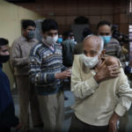 
              An elderly man leaves after getting Covid-19 vaccination at a makeshift center in a government school in New Delhi, India, Friday, Jan. 28, 2022. Indian health officials said that the first signs of COVID-19 infections plateauing in some parts of the vast country were being seen, but cautioned that cases were still surging in some states. (AP Photo/Manish Swarup)
            