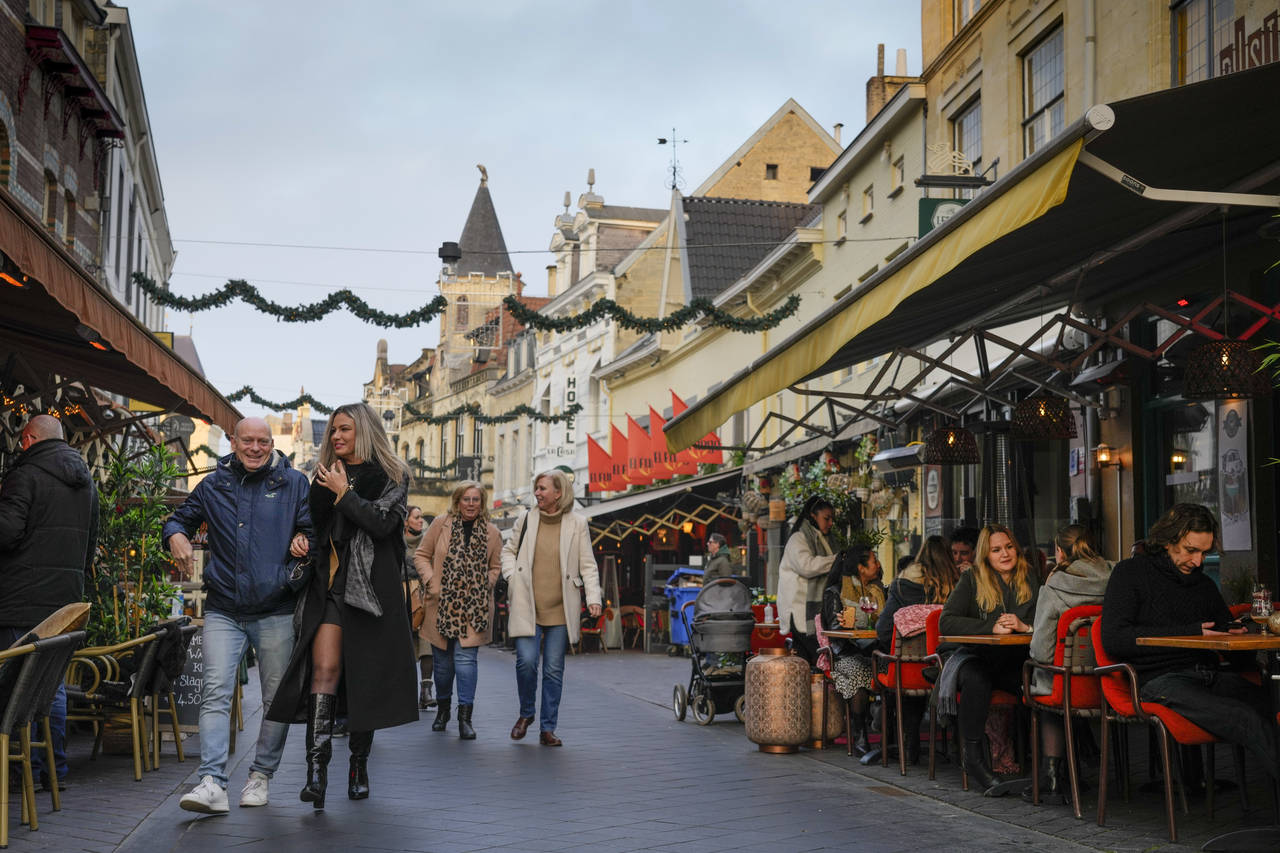 People enjoy the reopening of bars in Valkenburg, southern Netherlands, Friday, Jan. 14, 2022, wher...