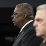 
              Secretary of Defense Lloyd Austin and Joint Chiefs Chairman Gen. Mark Milley speak during a media briefing at the Pentagon, Friday, Jan. 28, 2022, in Washington. (AP Photo/Alex Brandon)
            