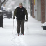 
              Brian Hill from Squirrel Hill skis along Forbes Avenue Monday, Jan. 17, 2022, in Squirrel Hill neighborhood of Pittsburgh. (Pam Panchak/Pittsburgh Post-Gazette via AP)
            