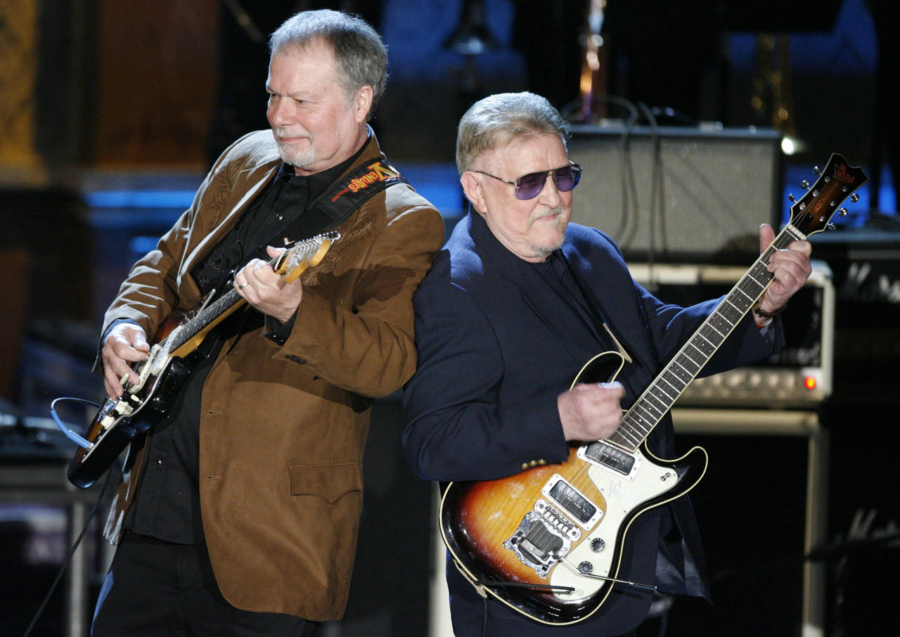 FILE - Bob Spalding, left, and Don Wilson of The Ventures perform at the Rock and Roll Hall of Fame...
