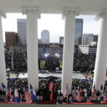 
              Virginia Gov. Glenn Youngkin is sworn into office as his wife Suzanne looks on at the Capitol Saturday Jan. 15, 2022, in Richmond, Va. (AP Photo/Steve Helber)
            