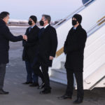
              Secretary of State Antony Blinken, second from right, is greeted by Ukrainian Deputy Foreign Minister Dmytro Senik, left, as he arrives at the Boryspil International Airport, Wednesday, Jan. 19, 2022, in Kyiv, Ukraine. (AP Photo/Alex Brandon, Pool)
            
