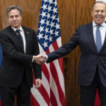 
              US Secretary of State Antony Blinken, left, shakes hands with Russian Foreign Minister Sergey Lavrov before their meeting, Friday, Jan. 21, 2022, in Geneva, Switzerland. (AP Photo/Alex Brandon, Pool)
            