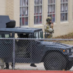 
              Law enforcement teams stage near Congregation Beth Israel while conducting SWAT operations in Colleyville, Texas on Saturday afternoon, Jan. 15, 2022. Authorities said a man took hostages Saturday during services at the synagogue where the suspect could be heard ranting in a livestream and demanding the release of a Pakistani neuroscientist who was convicted of trying to kill U.S. Army officers in Afghanistan. (Lynda M. Gonzalez/The Dallas Morning News via AP)
            