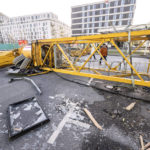 
              A construction crane lay after crashing in central Malmo, Sweden, Sunday Jan. 30, 2022, after a powerful winter storm swept through northern Europe over the weekend. Storm Malik was advancing in the Nordic region on Sunday, bringing strong gusts of wind, and extensive rain and snowfall in Denmark, Finland, Norway and Sweden. (Johan Nilsson/TT via AP)
            