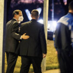 
              Congregation Beth Israel Rabbi Charlie Cytron-Walker, left, walks into a healing service with an unidentified man Monday night, Jan. 17, 2022, at White’s Chapel United Methodist Church in Southlake, Texas. Cytron-Walker was one of four people held hostage by a gunman at his Colleyville, Texas, synagogue on Saturday. (Yffy Yossifor/Star-Telegram via AP)
            