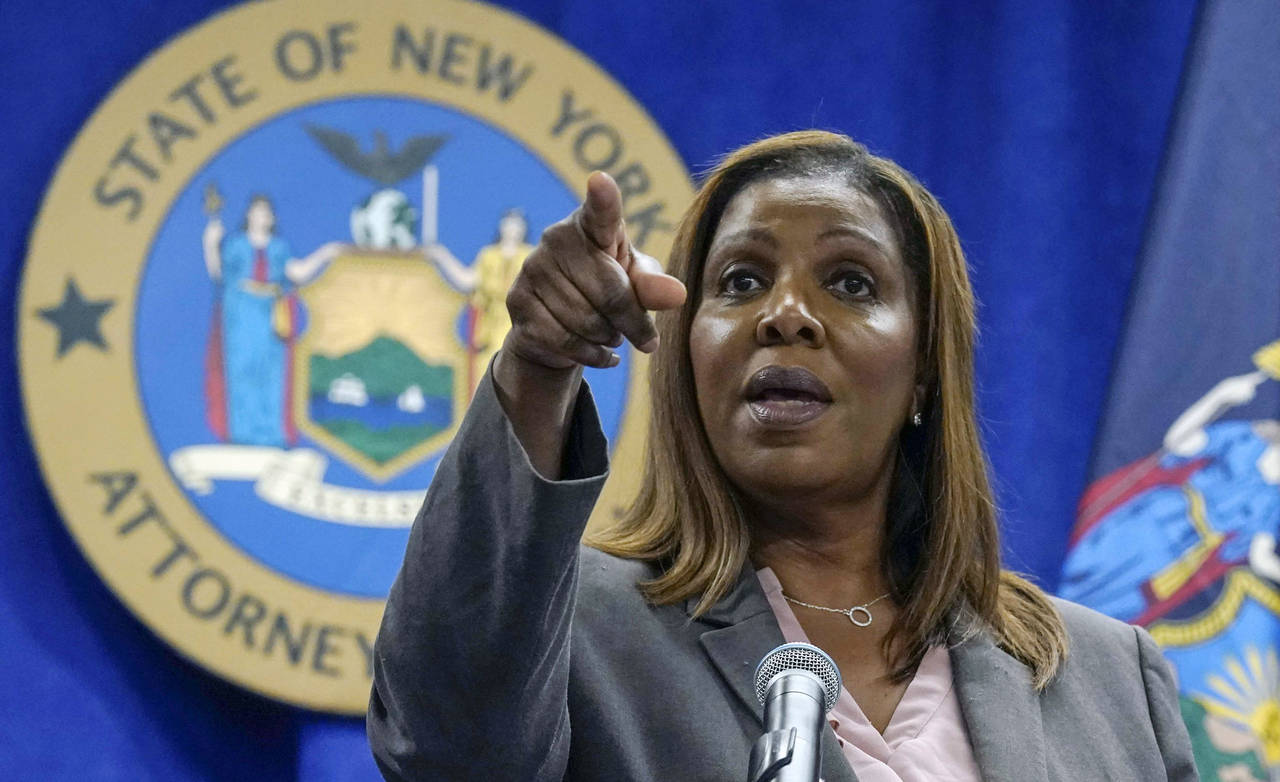 FILE - New York Attorney General Letitia James acknowledges questions from journalists at a news co...