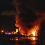 
              Smoke and flames fill the air from a large chemical fire in Passaic, N.J. on Friday Jan. 14, 2022. Authorities say the fire Friday night and Saturday morning at Majestic Industries and the Qualco chemical plant in Passaic spread to multiple buildings and threatened their collapse. (Anne-Marie Caruso /The Record via AP)
            