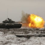 
              A Russian tank T-72B3 fires as troops take part in drills at the Kadamovskiy firing range in the Rostov region in southern Russia, Wednesday, Jan. 12, 2022. Russia has rejected Western complaints about its troop buildup near Ukraine, saying it deploys them wherever it deems necessary on its own territory. (AP Photo)
            