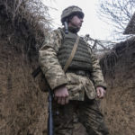 
              A Ukrainian soldier stands in the trench on the line of separation from pro-Russian rebels, Mariupol, Donetsk region, Ukraine, Friday, Jan. 21, 2022. Blinken said the U.S. would be open to a meeting between Putin and U.S. President Joe Biden, if it would be “useful and productive.” The two have met once in person in Geneva and have had several virtual conversations on Ukraine that have proven largely inconclusive. Washington and its allies have repeatedly promised consequences such as biting economic sanctions against Russia — though not military action — if it invades. (AP Photo/Andriy Dubchak)
            