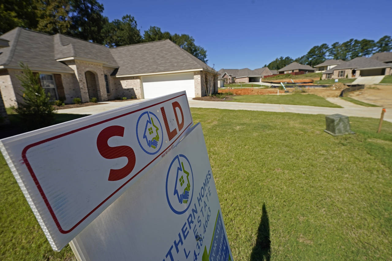 A "Sold" sign is on display on the lawn of a new house in Pearl, Miss., Thursday, Sept. 23, 2021. F...