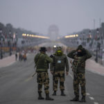 
              Indian paramilitary soldiers stand guard near a police barricade on Rajpath, the ceremonial boulevard, ahead of Republic Day celebrations in New Delhi, India, Tuesday, Jan. 25, 2022. (AP Photo/Altaf Qadri)
            