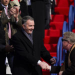 
              Virginia Gov. Ralph Northam heads to his seat before an inauguration ceremony for Gov. elect Glenn Youngkin, Saturday, Jan. 15, 2022, in Richmond, Va. (AP Photo/Julio Cortez)
            