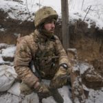 
              An Ukrainian serviceman sits at his position in a trench on the front line in the Luhansk region, eastern Ukraine, Friday, Jan. 28, 2022. High-stakes diplomacy continued on Friday in a bid to avert a war in Eastern Europe. The urgent efforts come as 100,000 Russian troops are massed near Ukraine's border and the Biden administration worries that Russian President Vladimir Putin will mount some sort of invasion within weeks. (AP Photo/Vadim Ghirda)
            
