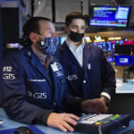 
              In this photo provided by the New York Stock Exchange, specialist Michael Pistillo, left, works with a colleague at his post on the floor, Friday, Jan. 28, 2022. Stocks rose in afternoon trading on Wall Street Friday, potentially trimming losses for some of the major indexes this week. (Allie Joseph/New York Stock Exchange via AP)
            