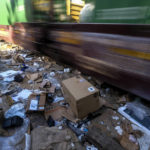 
              Shredded boxes and packages are seen at a section of the Union Pacific train tracks in downtown Los Angeles Friday, Jan. 14, 2022. Thieves have been raiding cargo containers aboard trains nearing downtown Los Angeles for months, leaving the tracks blanketed with discarded packages. The sea of debris left behind included items that the thieves apparently didn't think were valuable enough to take, CBSLA reported Thursday. (AP Photo/Ringo H.W. Chiu)
            