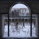 
              Members of a Ukrainian far-right group train in Kharkiv, Ukraine, Saturday, Jan. 29, 2022. The situation in Kharkiv, just 40 kilometers (25 miles) from some of the tens of thousands of Russian troops massed at the border of Ukraine, feels particularly perilous. If Russia invades, some of Kharkiv's 1 million plus people say they stand ready to abandon their civilian lives and wage a guerilla campaign against one of the world's greatest military powers. They expect many Ukrainians will do the same. (AP Photo/Evgeniy Maloletka)
            