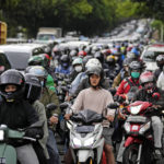 
              Motorists are stuck in the morning rush hour traffic in Jakarta, Indonesia, Wednesday, Jan. 26, 2022. Indonesian parliament last week passed the state capital bill into law, giving green light to President Joko Widodo to start a $34 billion construction project this year to move the country's capital from the traffic-clogged, polluted and rapidly sinking Jakarta on the main island of Java to jungle-clad Borneo island amid public skepticism. (AP Photo/Dita Alangkara)
            