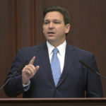 
              FILE - Florida Gov. Ron DeSantis addresses a joint session of a legislative session, Jan. 11, 2022, in Tallahassee, Fla. Democratic and Republican governors are taking vastly different approaches to addressing the ongoing pandemic in their state of the state speeches.  (AP Photo/Phelan M. Ebenhack, File)
            