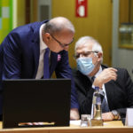 
              European Union foreign policy chief Josep Borrell, right, speaks with Croatia's Foreign Minister Gordan Grlic Radman during a meeting of EU foreign ministers at the European Council building in Brussels, Monday, Jan. 24, 2022. European Union foreign ministers are aiming Monday to show a fresh display of resolve and unity in support of Ukraine, amid deep uncertainty about whether President Vladimir Putin intends to attack Russia's neighbor or send his troops across the border. (AP Photo/Virginia Mayo)
            