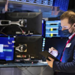 
              In this photo provided by the New York Stock Exchange, trader Ben Tuchman works on the floor, Friday, Jan. 28, 2022. Stocks rose in afternoon trading on Wall Street Friday, potentially trimming losses for some of the major indexes this week. (Allie Joseph/New York Stock Exchange via AP)
            