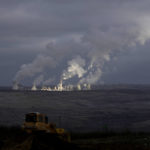 
              Smoke rises from chimneys of Turow power plant located by the Turow lignite coal mine near the town of Bogatynia, Poland, Saturday, Jan. 15, 2022. The Polish lignite mine is located near the Czech border and Czech authorities have said it negatively affects the environment and drains water from local villages. (AP Photo/Petr David Josek)
            