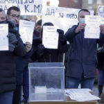 
              Kosovo Serbs protest against banning ethnic Serbs voting on Kosovo in Serbia's referendum on constitutional changes, in Mitrovica, Kosovo, Sunday, Jan. 16, 2022.  The Serbian government has said the amendments are designed to boost independence of the judiciary and are part of reform needed for Serbia's European Union membership bid. (AP Photo/Bojan Slavkovic)
            