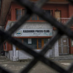 
              Kashmir Press Club building is pictured through a closed gate after it was sealed by authorities in Srinagar, Indian controlled Kashmir, Tuesday, Jan. 18, 2022. Last week, a few journalists supportive of the Indian government, with assistance from armed police, took control of the region’s only independent press club. Authorities shut it down a day later, drawing sharp criticism from journalist bodies. Reporters Without Borders called it an “undeclared coup” and said the region is “steadily being transformed into a black hole for news and information.” The government defended its move by citing “potential law and order situation” and “the safety of bona fide journalists.” (AP Photo/Dar Yasin)
            