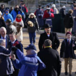 
              People arrive to the gallery ahead of the inauguration ceremony, Saturday, Jan. 15, 2022, in Richmond. Virginia Gov.-elect Glenn Youngkin will be sworn in today. (AP Photo/Julio Cortez)
            