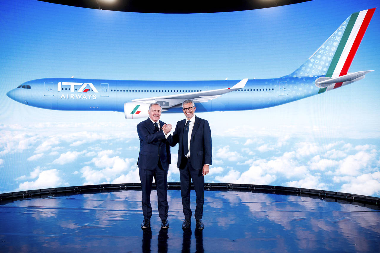 FILE - Fabio Lazzerini, right, CEO of new national carrier ITA, poses with President Alfredo Altavi...