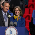 
              Gov. Glenn Youngkin, with wife Suzanne Youngkin takes the oath of office during an inauguration ceremony, Saturday, Jan. 15, 2022, in Richmond, Va. (AP Photo/Julio Cortez)
            