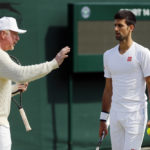 
              FILE - Novak Djokovic, of Serbia, right, speaks with his coach Boris Becker before resuming his men's singles match against Sam Querrey of the U.S on day six of the Wimbledon Tennis Championships in London, July 2, 2016. Becker, a former top-ranked player who coached Djokovic from 2013-2016, said the same determination and stubbornness that fuels Djokovic's strength on court can also be his weakness. (AP Photo/Ben Curtis, File)
            