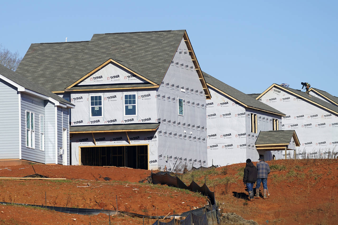 New homes are seen under construction in Mebane, N.C., Monday, Jan. 10, 2022.  Construction of new ...