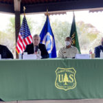 
              U.S. Sen. Mark Kelly, D-Ariz., left, Agriculture Secretary Tom Vilsack, Forest Service Chief Randy Moore and U.S. Rep. Tom O'Halleran, D-Ariz., discuss forest fires at the Desert Botanical Garden in Phoenix on Tuesday, Jan. 18, 2022. The Biden administration plans to significantly expand efforts to stave off catastrophic wildfires that have torched areas of the U.S. West. (AP Photo/Jonathan J. Cooper)
            