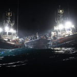 
              Migrants are rescued off the coast of Lampedusa on Tuesday Jan. 25, 2022. Seven migrants have died and some 280 have been rescued by the Italian Coast Guard after they were discovered in a packed wooden boat off the coast of the Italian island of Lampedusa. (AP Photo/Pau de la Calle)
            