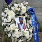 
              FILE - A photo of Sandra Shells is seen in a memorial wreath in downtown Los Angeles on Jan. 19, 2022, at the bus stop where she was attacked the week before. Three random killings: a woman pushed in front of a train, another punched at a bus stop and a third stabbed to death while working alone in a store, and three homeless men charged with the crimes have reignited anger and frustration with the intractable issue of homelessness in New York and Los Angeles. (AP Photo/Richard Vogel, File)
            