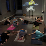 
              People take a yoga class at the Amsterdam Museum in Amsterdam, Wednesday, Jan. 19, 2022, as Dutch museums, theaters and concert halls played host Wednesday to businesses that are allowed to open to customers as a protest against their own continuing lockdown closures. (AP Photo/Peter Dejong)
            