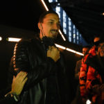 AC Milan striker Zlatan Ibrahimovic is greeted by spectators prior to the start of the DSquared F/W 22/23 fashion show, in Milan, Italy, Friday, Jan. 14, 2022. (AP Photo/Luca Bruno)