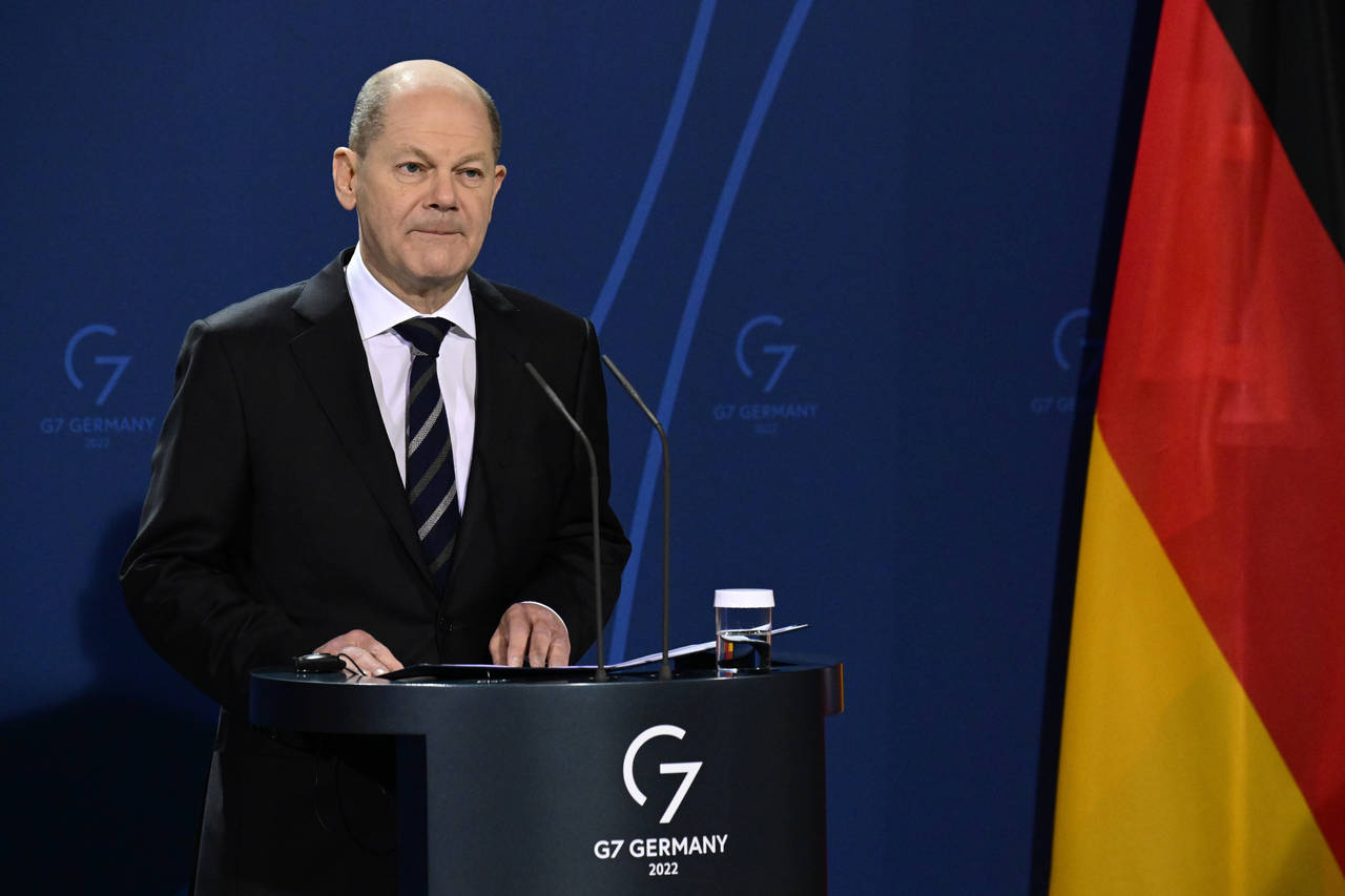 German Chancellor Olaf Scholz speaks during a media conference with French President Emmanuel Macro...