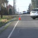 Pierce County Sheriff's cars parked near the scene in Midvale where two young girls were struck by a hit-and-run driver. (KIRO 7 TV)