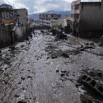 
              Mud fills a street after a rain-weakened hillside collapsed and brought waves of mud over La Gasca area of Quito, Ecuador, Tuesday, Feb. 1, 2022. (AP Photo/Dolores Ochoa)
            