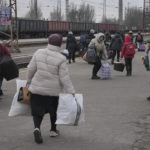 
              People waiting for a Kyiv bound train spread on a platform in Kostiantynivka, the Donetsk region, eastern Ukraine, Thursday, Feb. 24, 2022. Russia launched a wide-ranging attack on Ukraine on Thursday, hitting cities and bases with airstrikes or shelling, as civilians piled into trains and cars to flee. Ukraine's government said Russian tanks and troops rolled across the border in a “full-scale war” that could rewrite the geopolitical order and whose fallout already reverberated around the world. (AP Photo/Vadim Ghirda)
            