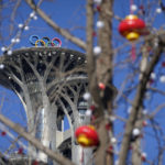 
              Lantern decorations are hung on trees on the Olympic Green near the Olympic Tower at the 2022 Winter Olympics, Tuesday, Feb. 1, 2022, in Beijing. Millions of people in China and beyond are celebrating the Lunar New Year holiday on Tuesday. (AP Photo/Mark Schiefelbein)
            