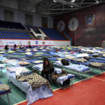 
              Displaced civilians from the Donetsk and Luhansk regions, the territory controlled by pro-Russia separatist governments in eastern Ukraine, rest in a sport hall in Taganrog, Russia, Monday, Feb. 21, 2022. World leaders are making another diplomatic push in hopes of preventing a Russian invasion of Ukraine, even as heavy shelling continues in Ukraine's east. (AP Photo)
            